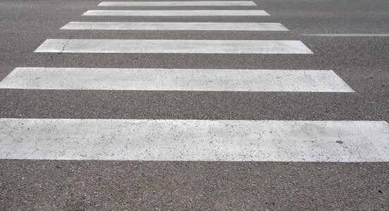 In-street ped crossing pedestrian crossing white stripes photo