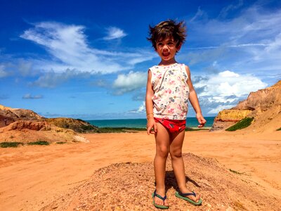 Holidays playing in the sand kid photo