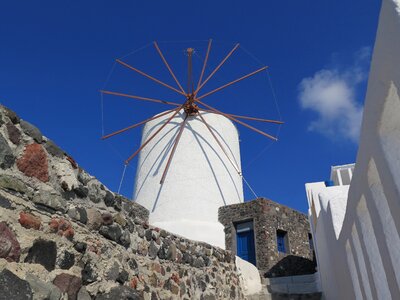 Windmill blue sky greece photo