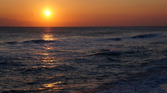 Sunset glow sea island photo