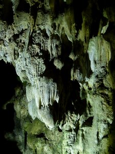 Stalagmites lighting grotto photo