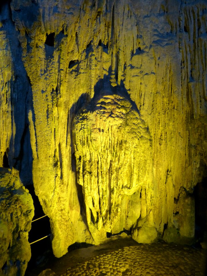 Stalagmites lighting grotto