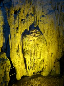 Stalagmites lighting grotto photo