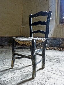 Old abandoned broken chair photo