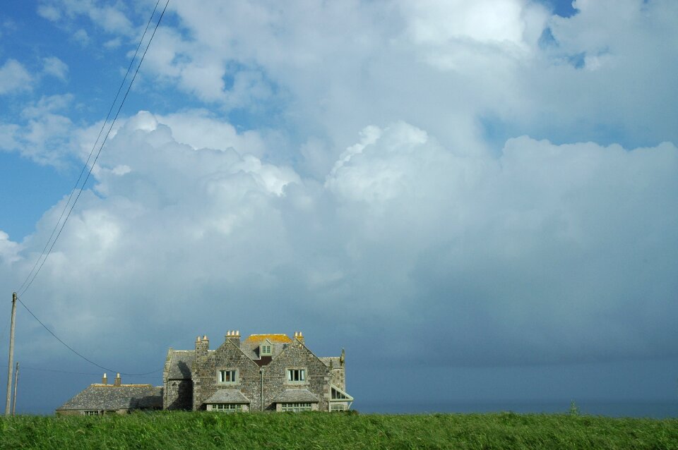 Coast house clouds photo