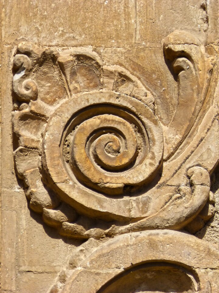 Carved stone church scroll