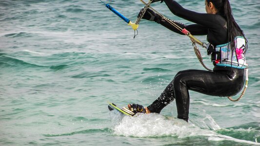 Woman athlete surfing photo