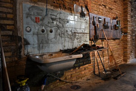 Clutter paintbrushes washbasin photo