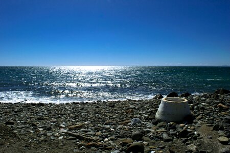 Horizon stones edge of the sea photo