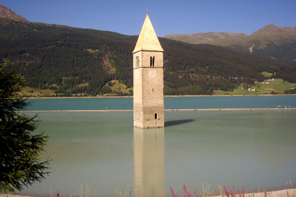 Reschen pass tower in water landscape photo