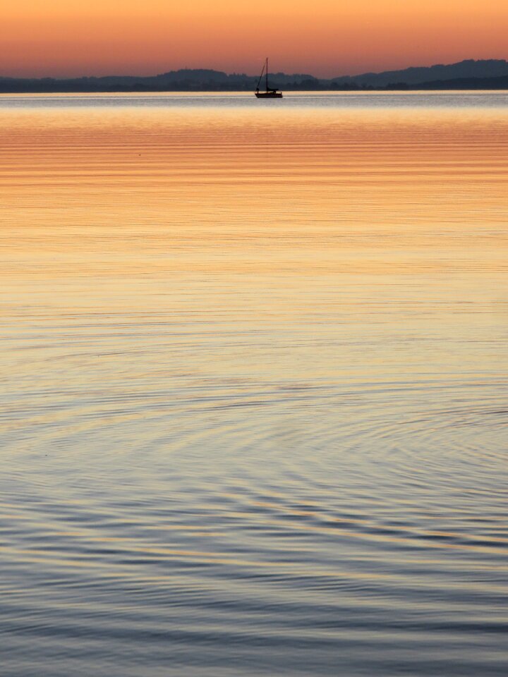Boat sunset wave