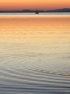 Boat sunset wave photo