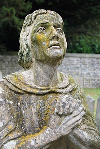 Praying sculpture figure