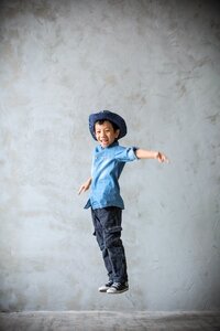 Child jumping for joy cheerful