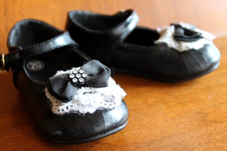 Black paint baby shoes photo