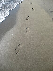Footprint tracks in the sand sand beach