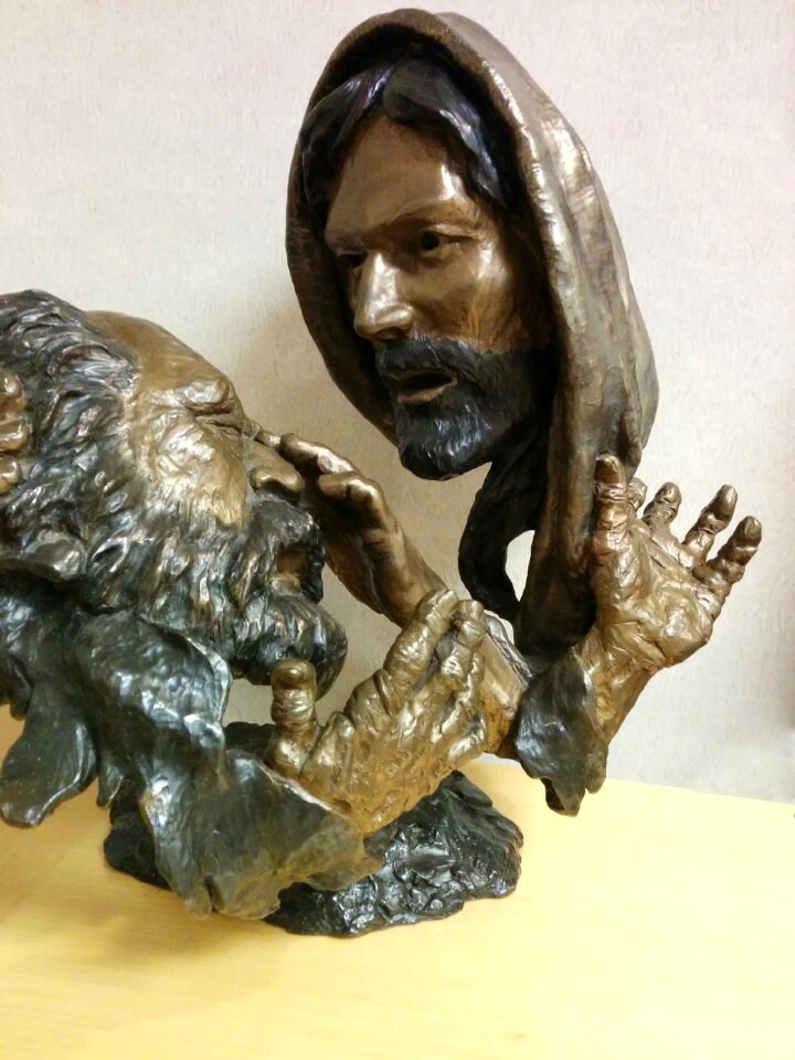Blind man carving brass