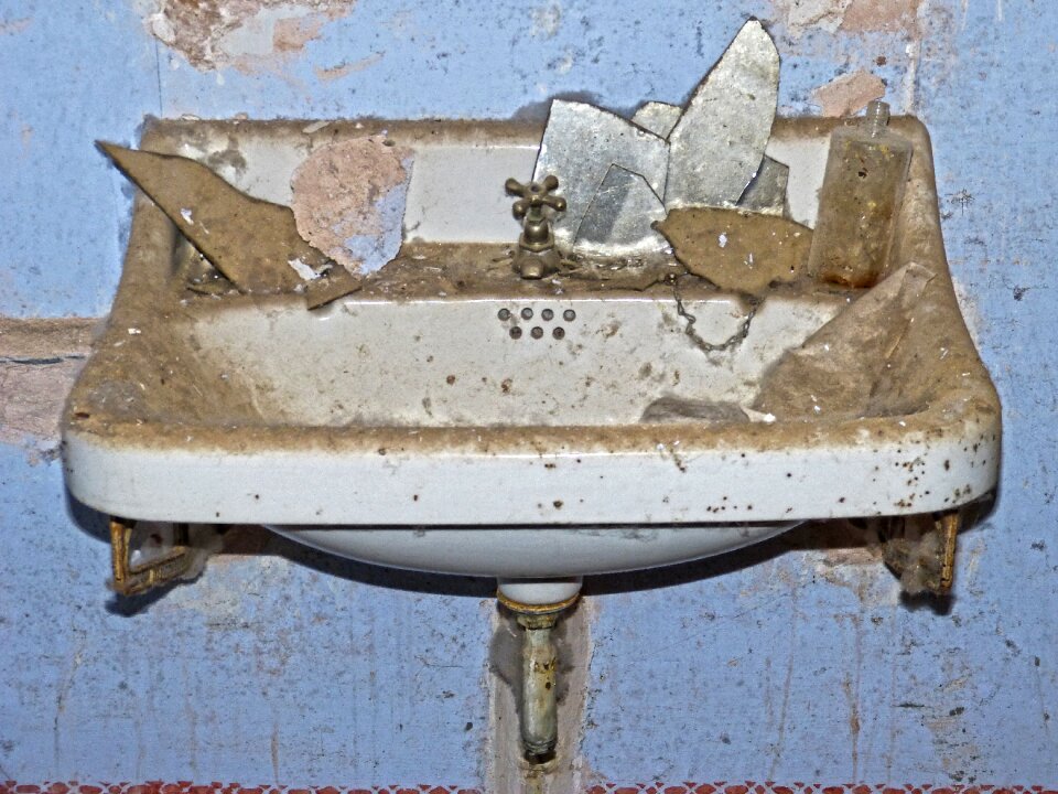 Abandoned porcelain bathroom