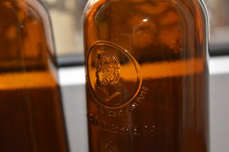 Glass bottle brown embossing