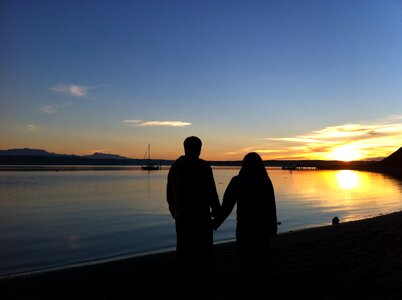 Holding hands sunset romance photo