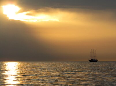 Sunset ship clouds photo