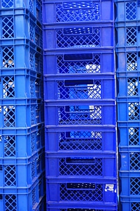 Blue stacked transport crates photo