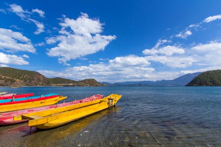 Lugu lake lake wooden boat photo