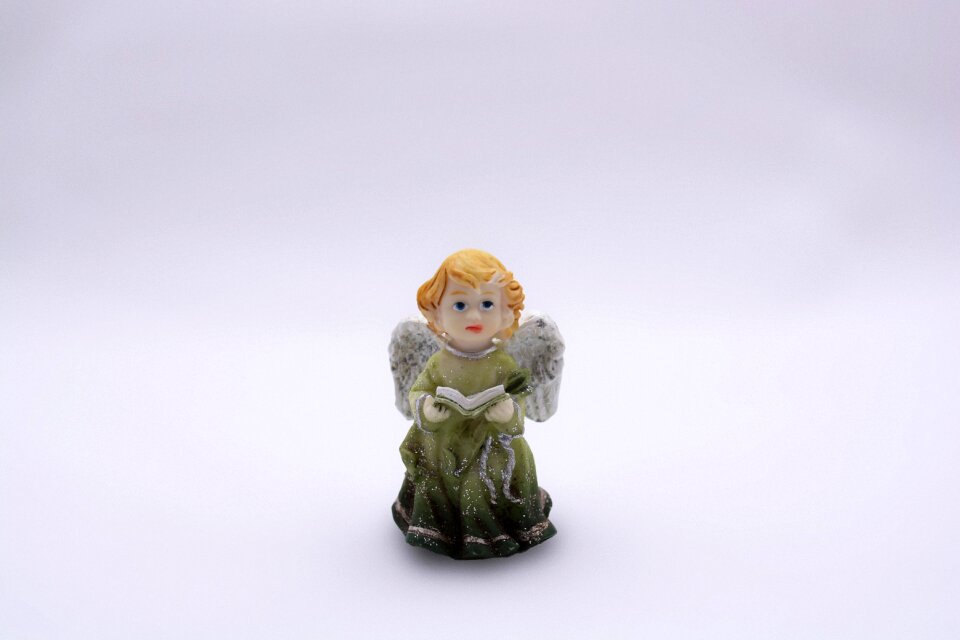 Statuette book a green dress