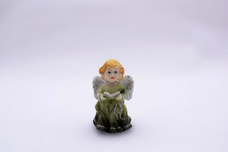 Statuette book a green dress