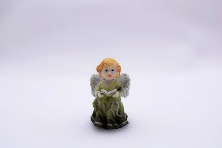 Statuette book a green dress photo