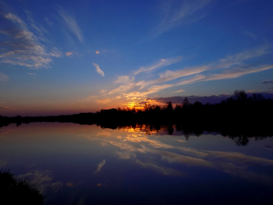Sky clouds river