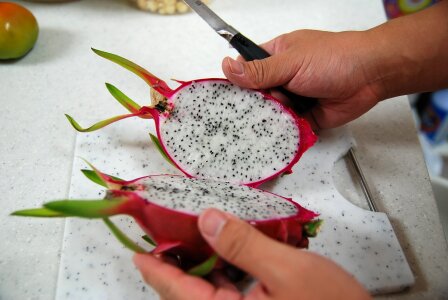 Cutting exotic pink fruit