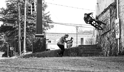 Filming bikes black and white photo