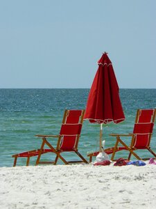 Sea sand umbrella photo