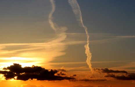 Dark clouds bright cloud contrail photo