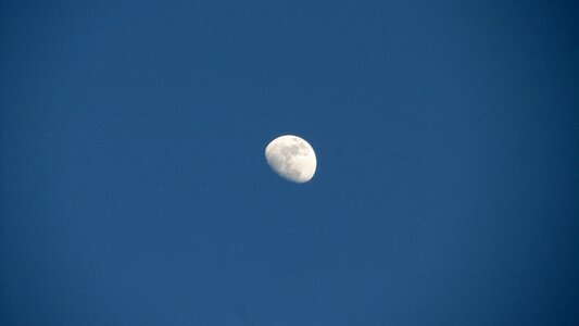 Moon blue sky daytime photo