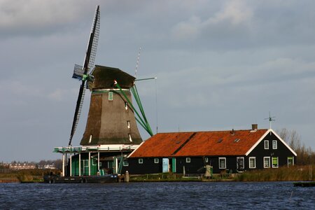 Windmill winter landscape water