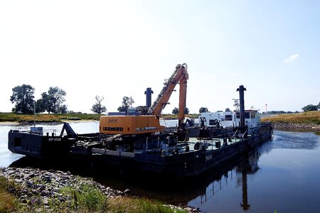River barge dredge the riverbed