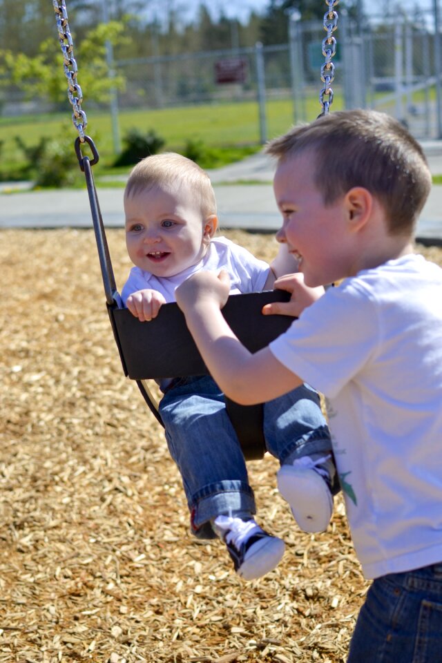 Swinging children brothers
