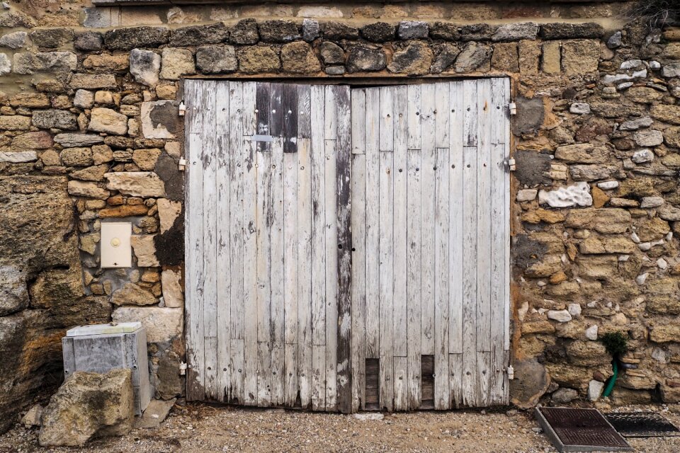 Wooden gate old stone wall