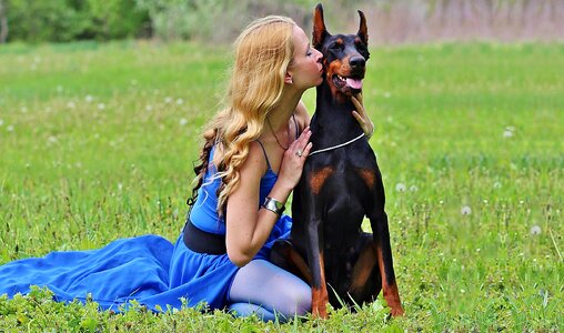 Doberman blonde woman love