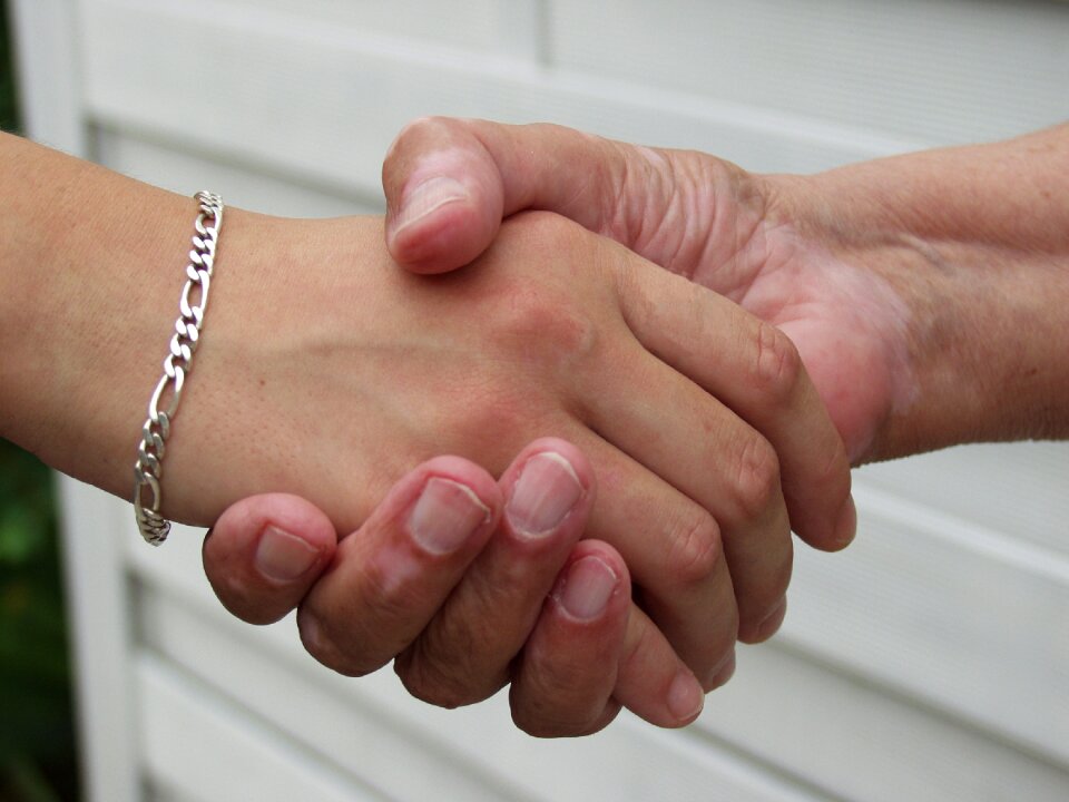 Hands old and young generations
