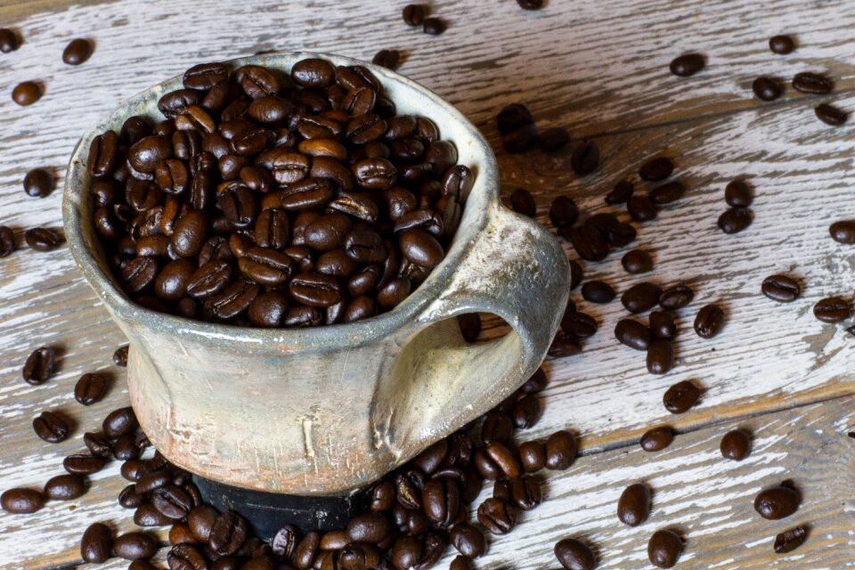 Cup spill coffee beans photo