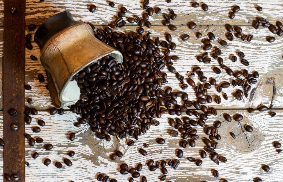 Cup spill coffee beans photo