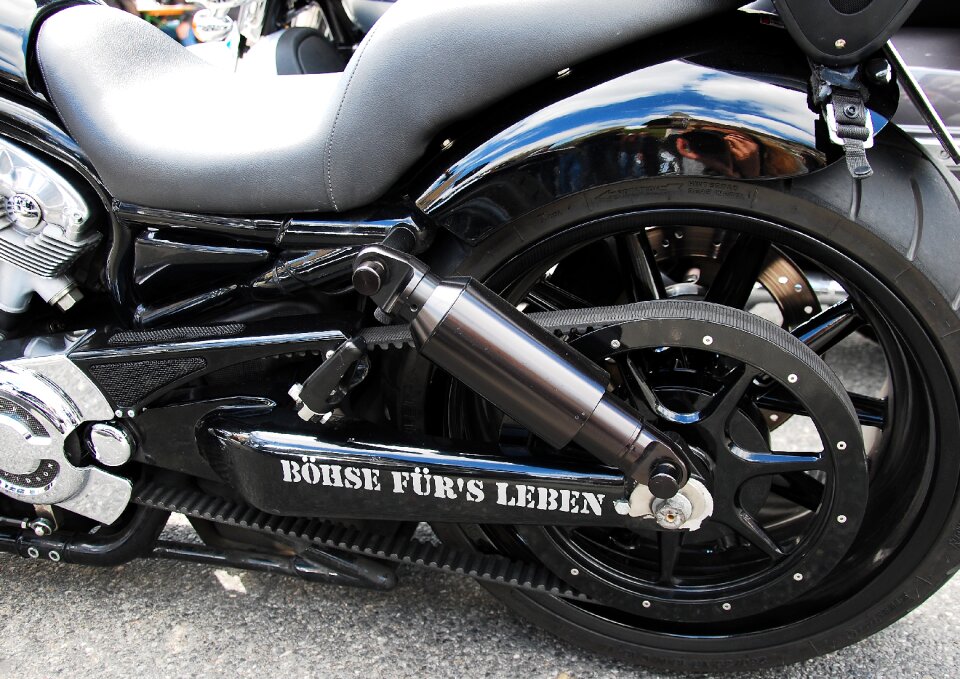 Two wheeled vehicle riding a motorcycle rear wheel