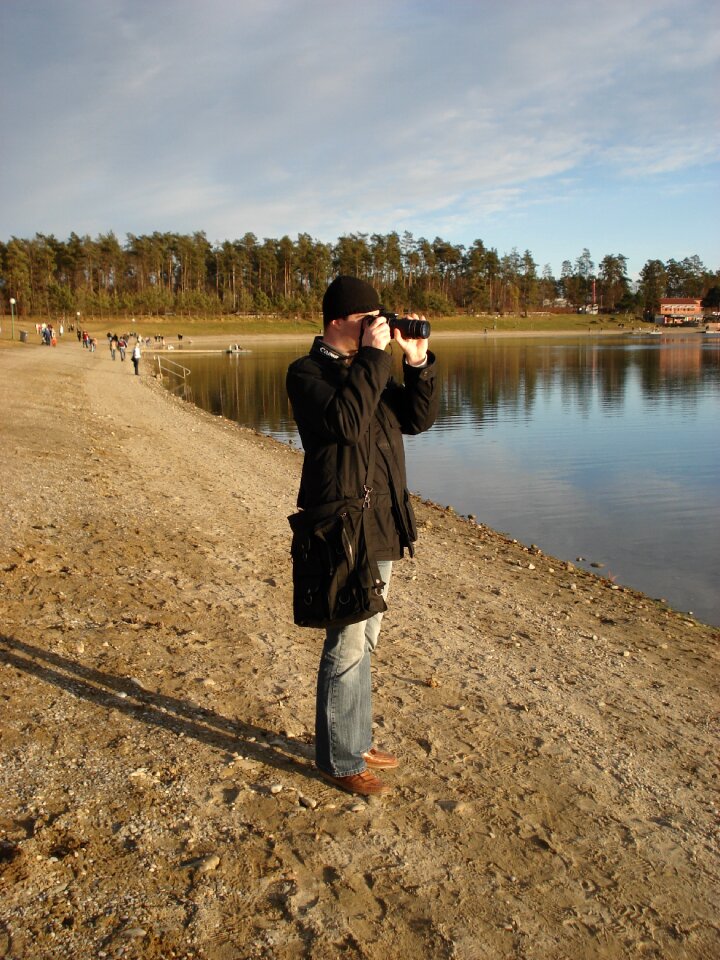 Man photographer lake