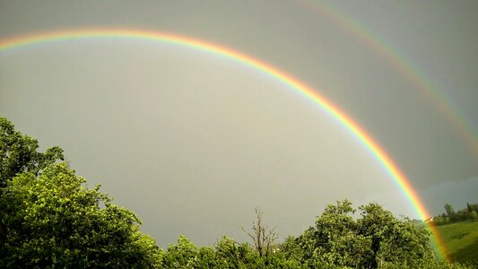 Rainbow landscape storm