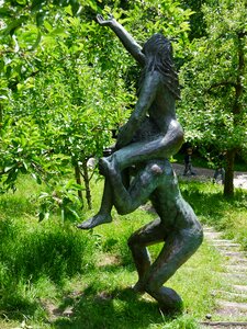 Bronze statue adam and eve figures photo