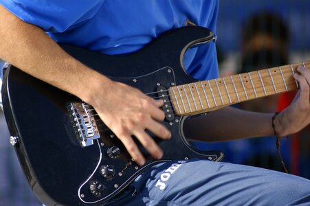 Hands playing musician