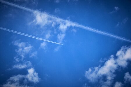 Contrail clouds flying photo